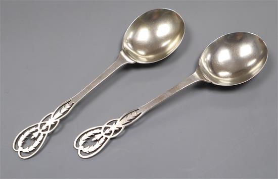 A pair of George V silver serving spoons with pierced terminals, Adie Bros, Birmingham, 1924, 4.5 oz.